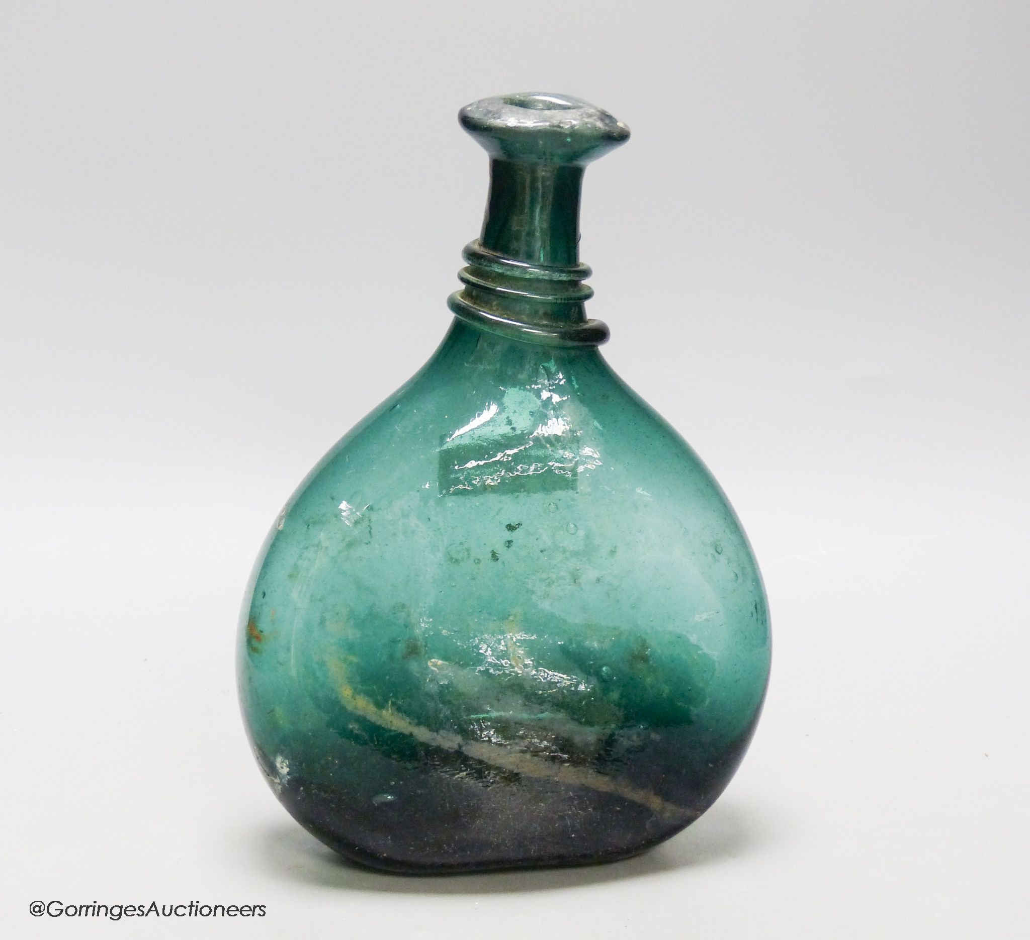 An 18th/19th century Persian green glass flask, Qajar dynasty, height 26cm